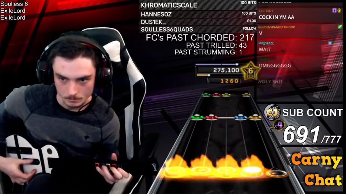 Геймер прошел самую сложную песню в игре Guitar Hero на 100% Геймер прошел самую сложную песню в игре Guitar Hero на 100%